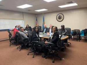 Members of the Banking Desert Initiative Advisory Board and employees of Del-One Federal Credit Union